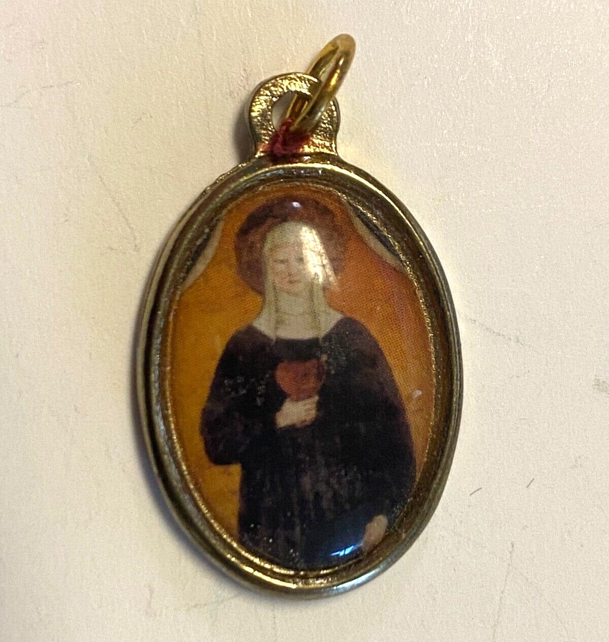 Oval Saint Clare of Montefalco medal by Bob and Penny Lord, religious Christian collectible from Italy with intricate religious imagery.