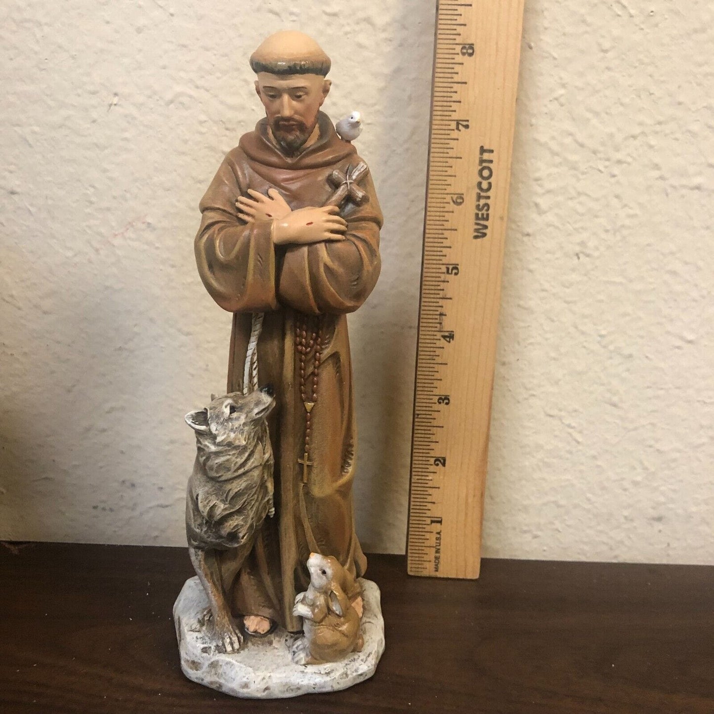 Saint Francis of Assisi 8-inch statue by Bob and Penny Lord, depicting the Christian saint in a peaceful pose, suitable for religious collectibles.