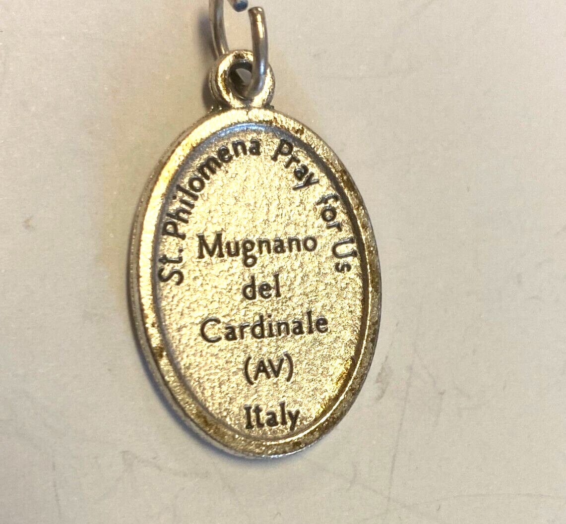 Saint Philomena silvertone medal from Italy, Christian religious collectible, featuring detailed religious iconography.