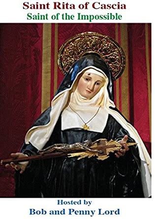 St. Rita printed minibook by Bob and Penny Lord showing a colorful cover with religious imagery and Saint Rita's portrait.