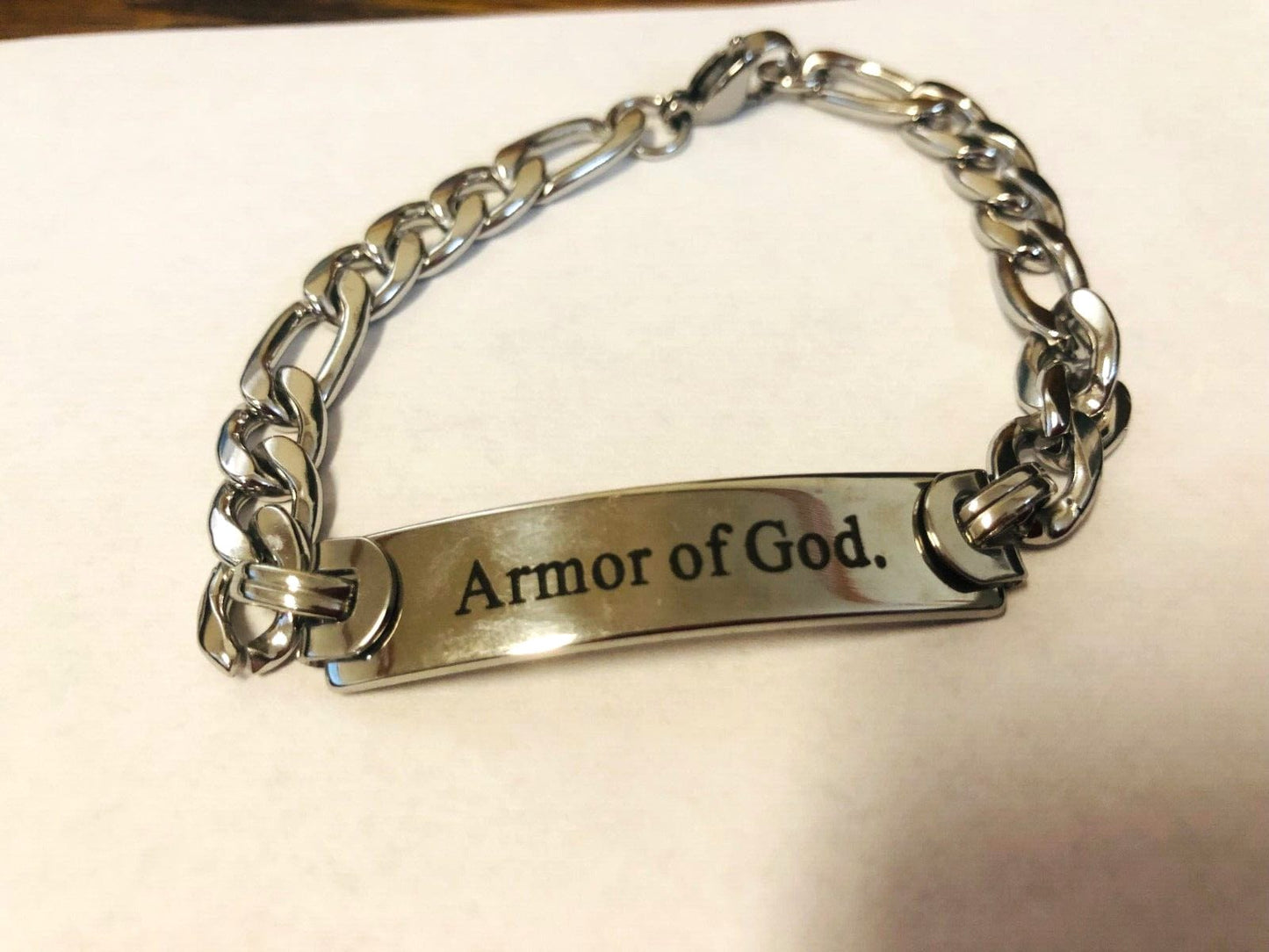 Berkander stainless steel Armor of God 8 L bracelet featuring detailed religious charm, stylish fashion jewelry accessory.