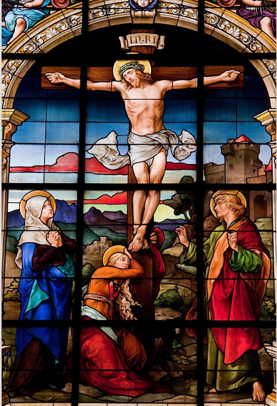 Book titled "The Rosary: The Life of Jesus and Mary" by Bob and Penny Lord, featuring a cover image of Jesus on the cross.